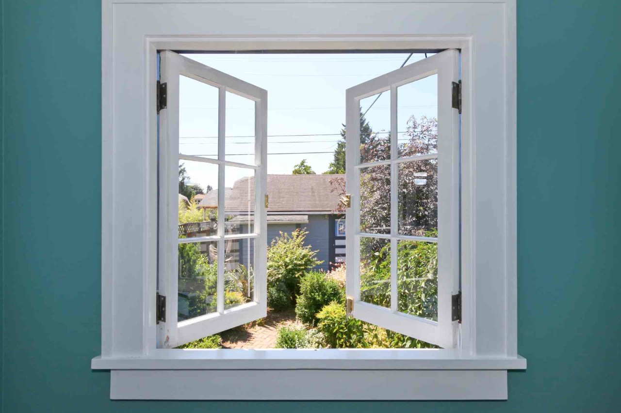 An open window with a view into a garden in the yard at In The Shade near Stuart Florida (FL)
