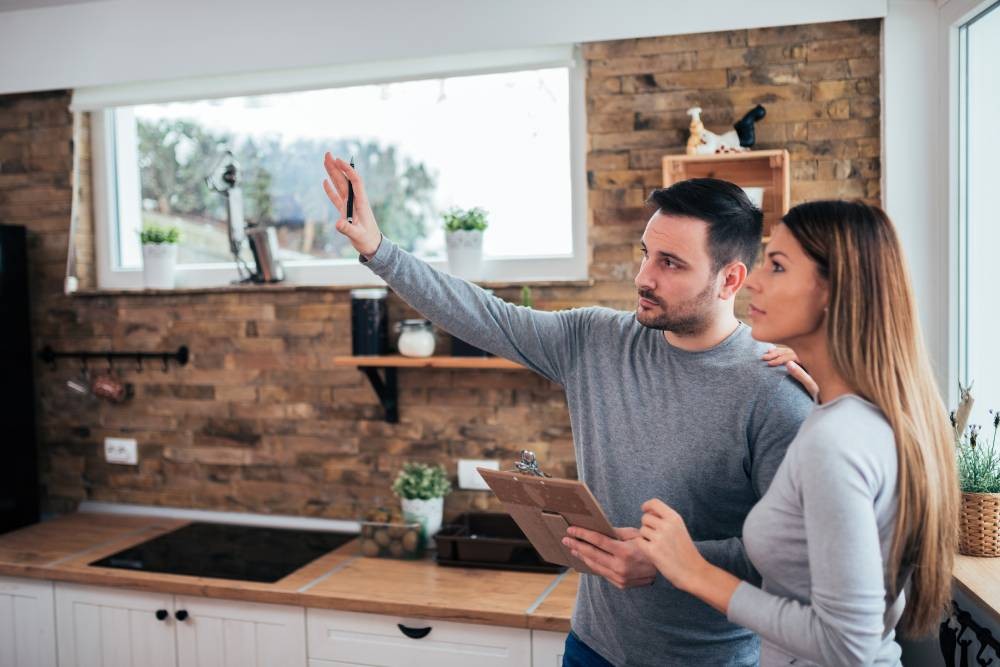 Two people talking about a home remodeling process at In The Shade near Stuart, Florida (FL)